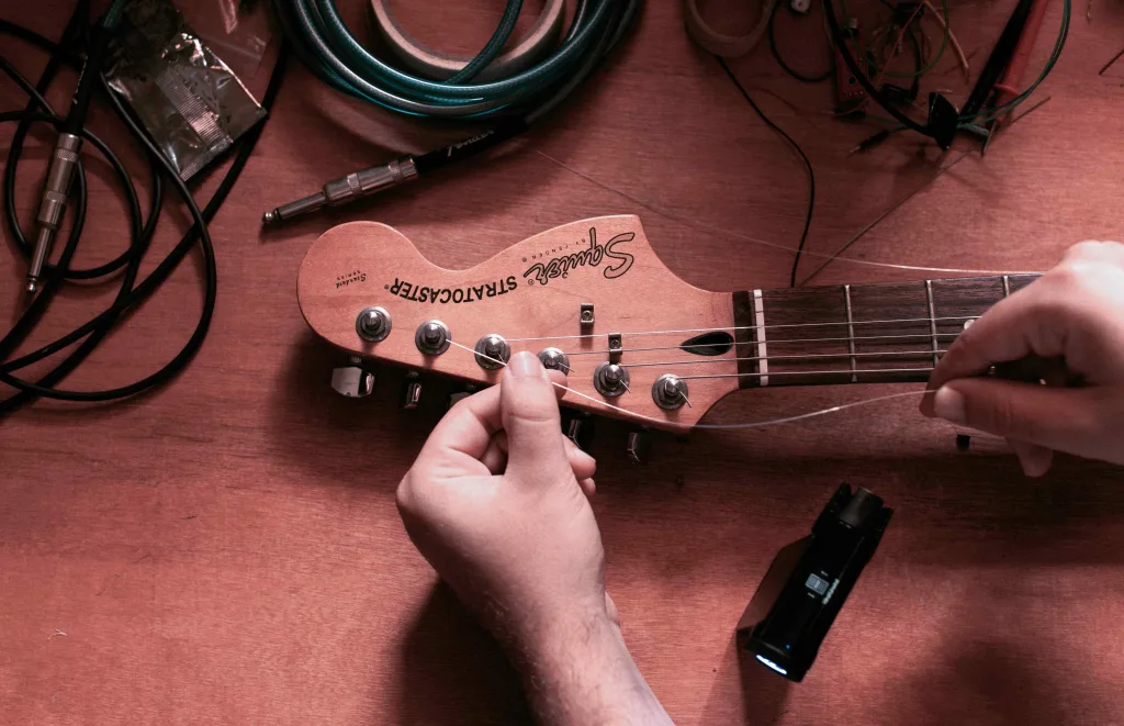 changing string on a guitar